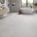 Vloertegel betonlook Concrete Grey 100 x 100 cm - badkamer met douche en vrijstaand bad op betonlook vloer in grijs