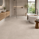 Concrete Moka 100 x 100 cm betonlook vloertegel in badkamer met douche en bad